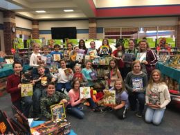 Student Council members pose with books donated to Texas Children's Hospital
